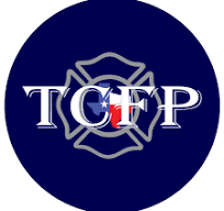 The image shows a blue circle with a gray firefighter badge outline. The letters "TCFP" are displayed in the center, with a Texas flag design embedded in the "C".